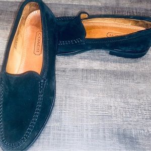 Women’s suede Coach slip on shoes.